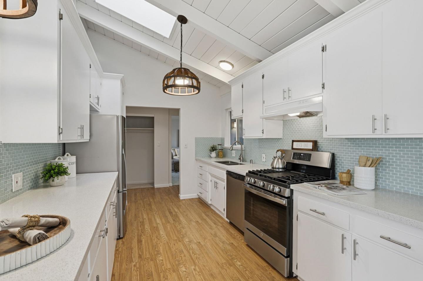 2119 Burr Court Santa Cruz, CA 95062 - Photo 15 of 38 a kitchen with stainless steel appliances kitchen island granite countertop a stove a sink and a refrigerator