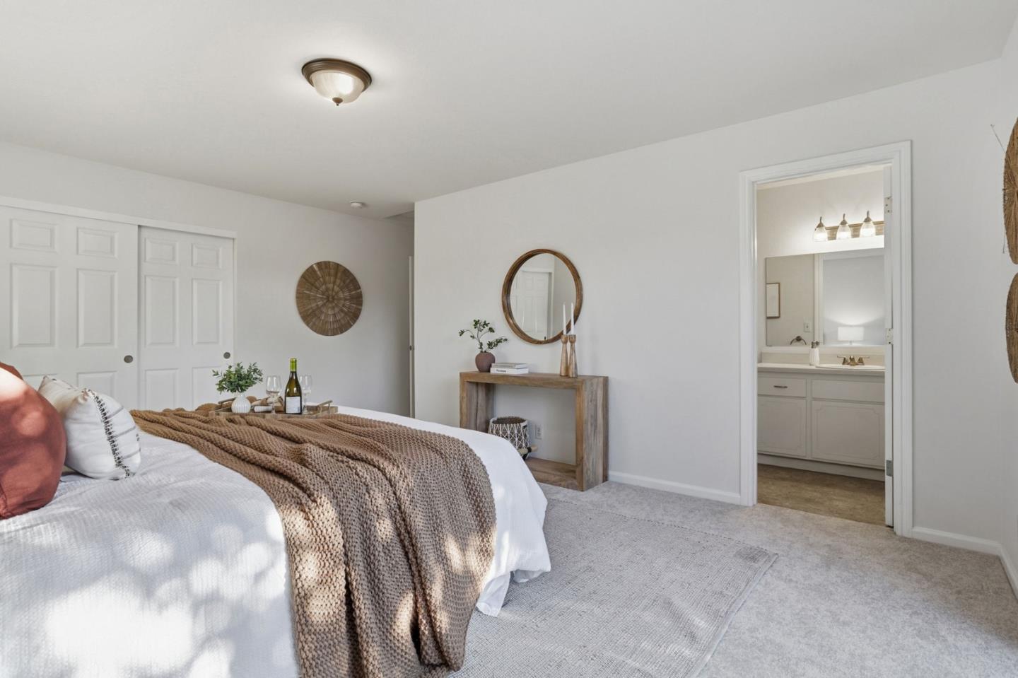 2119 Burr Court Santa Cruz, CA 95062 - Photo 25 of 38 a bedroom with a bed and a chandelier