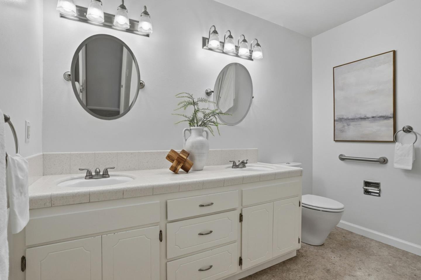2119 Burr Court Santa Cruz, CA 95062 - Photo 27 of 38 a bathroom with a toilet sink and mirror