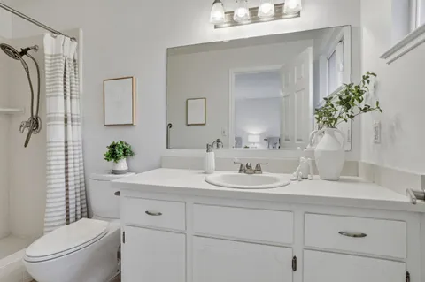 a patio with yard glass top table and chairs