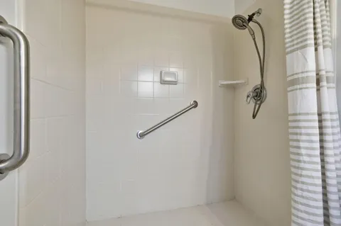 a view of a house with patio and a garden