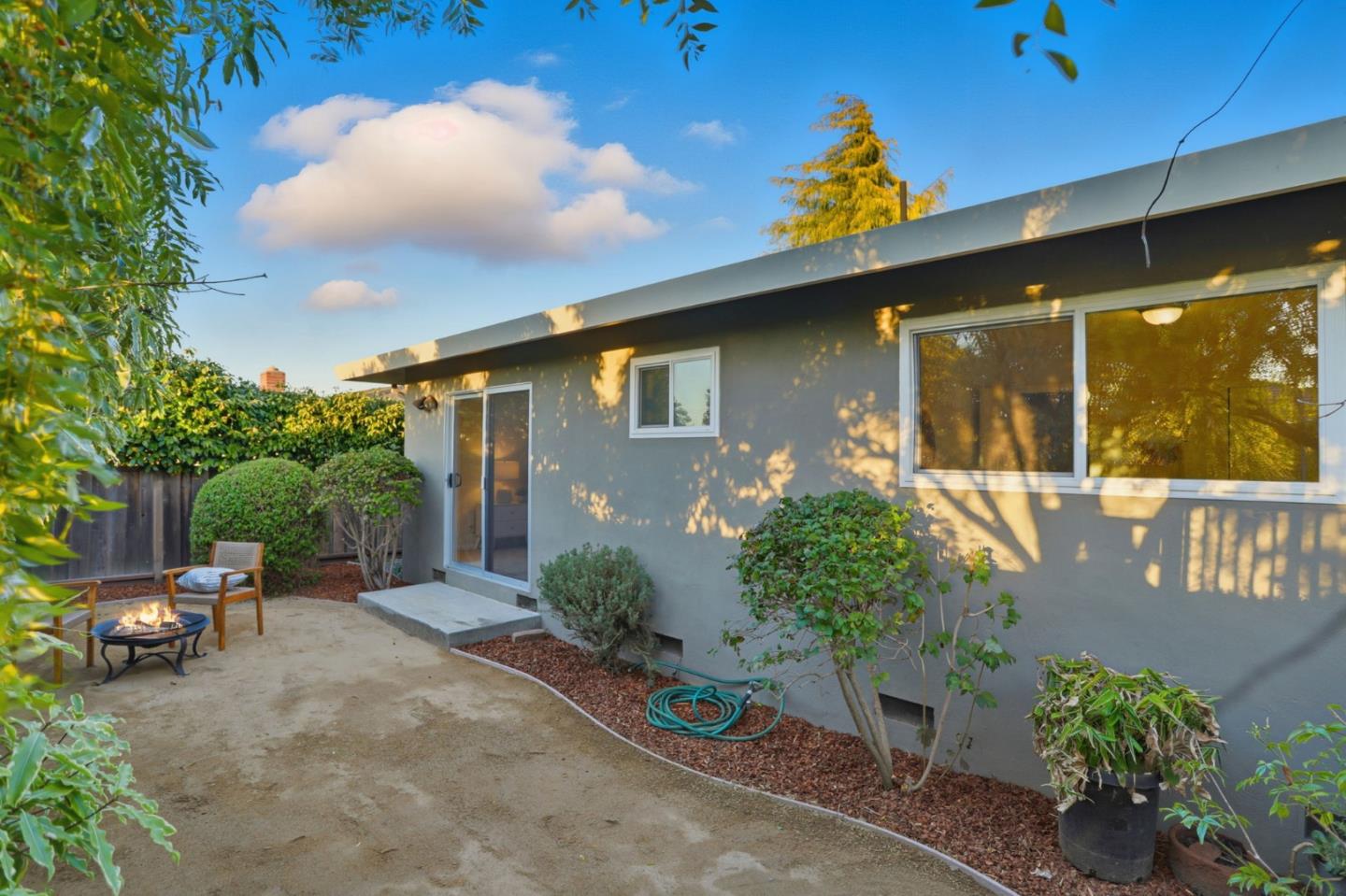 2119 Burr Court Santa Cruz, CA 95062 - Photo 36 of 38 a view of a patio with table and chairs potted plants