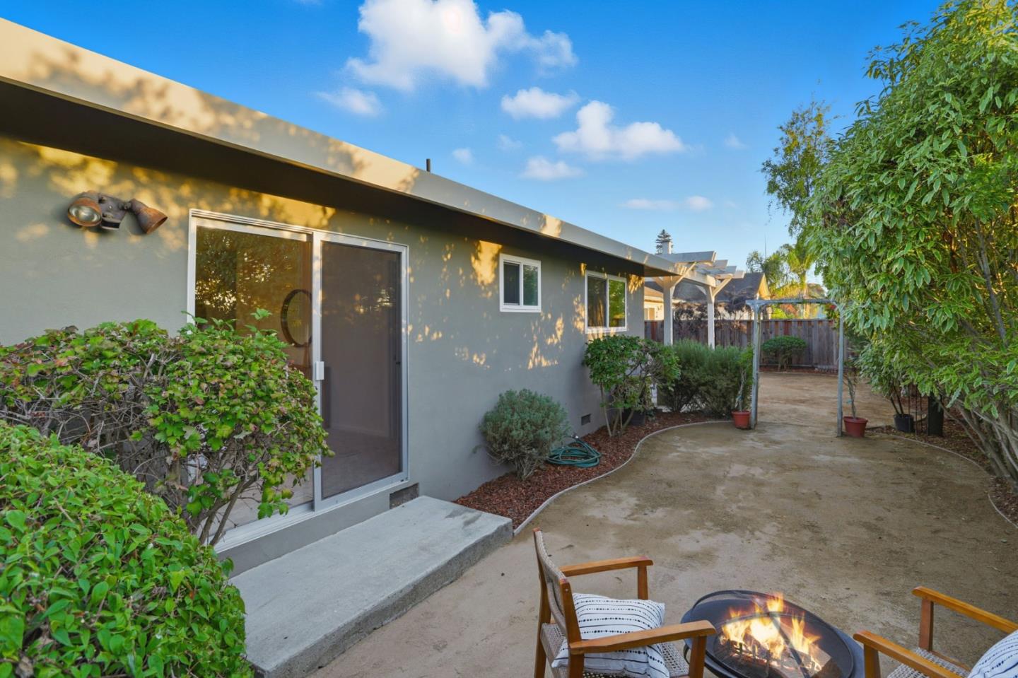 2119 Burr Court Santa Cruz, CA 95062 - Photo 37 of 38 a backyard of a house with flower plants