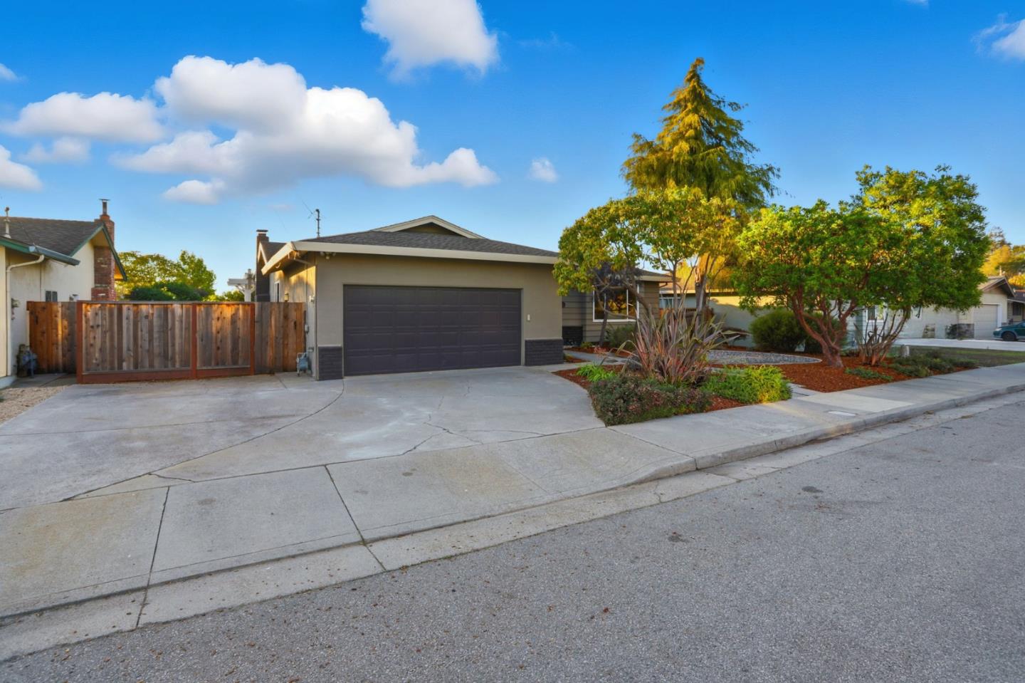 2119 Burr Court Santa Cruz, CA 95062 - Photo 4 of 38 a front view of a house with a yard and garage