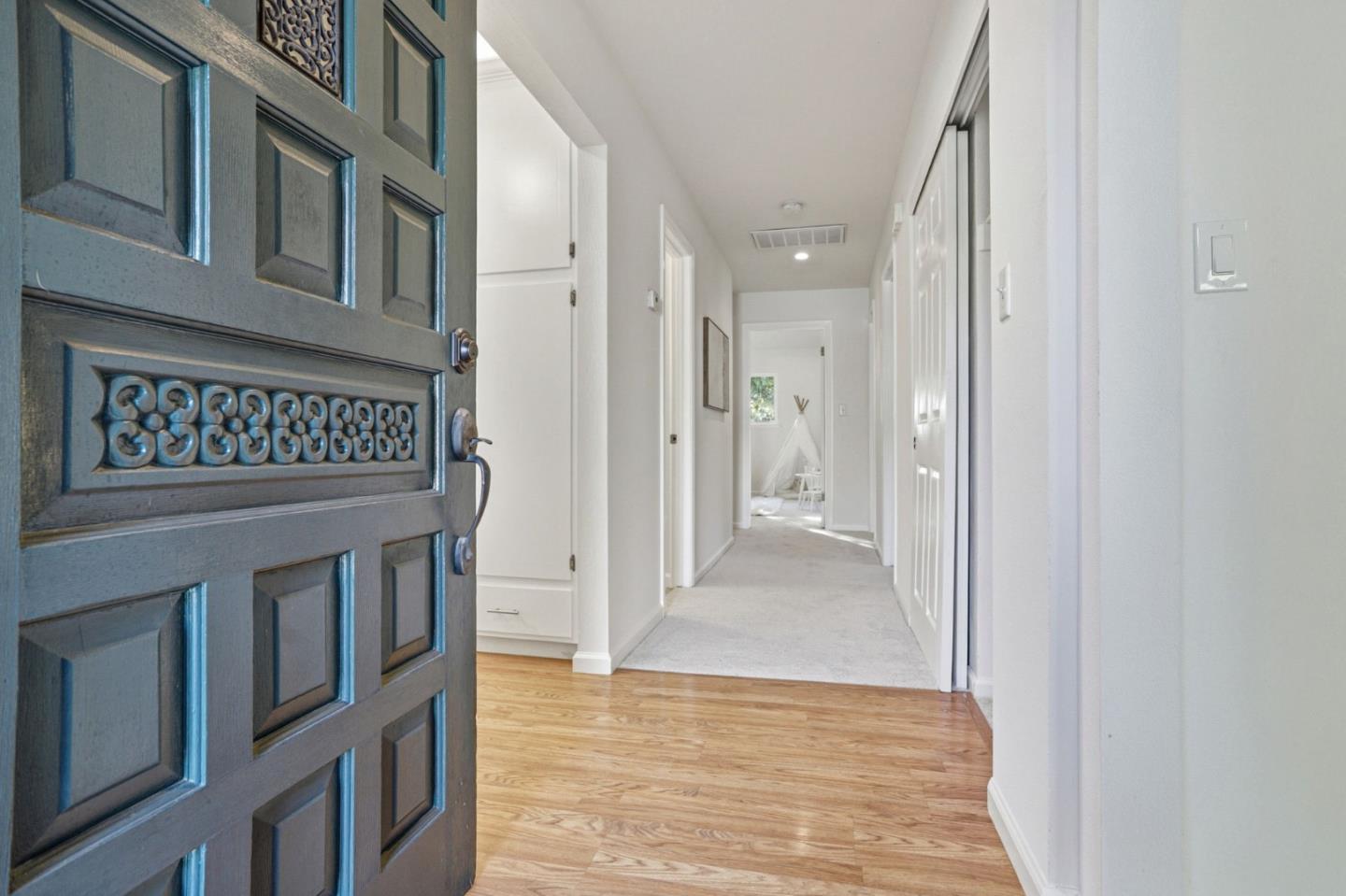 2119 Burr Court Santa Cruz, CA 95062 - Photo 7 of 38 a view of a hallway with entryway wooden floor and front door