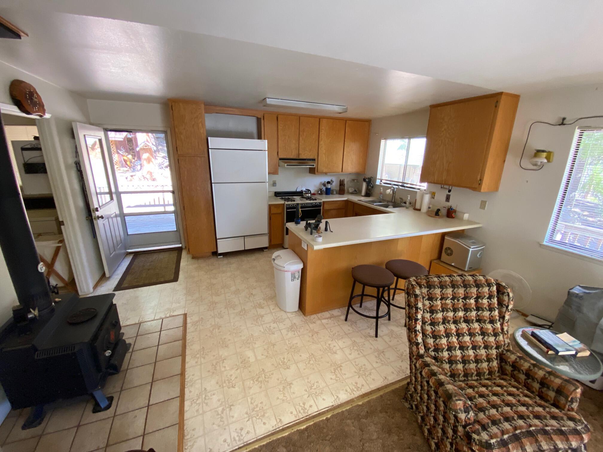 581 Mountain Aire Road Trinity Center, CA 96091 - Photo 26 of 48 Kitchen and wood stove