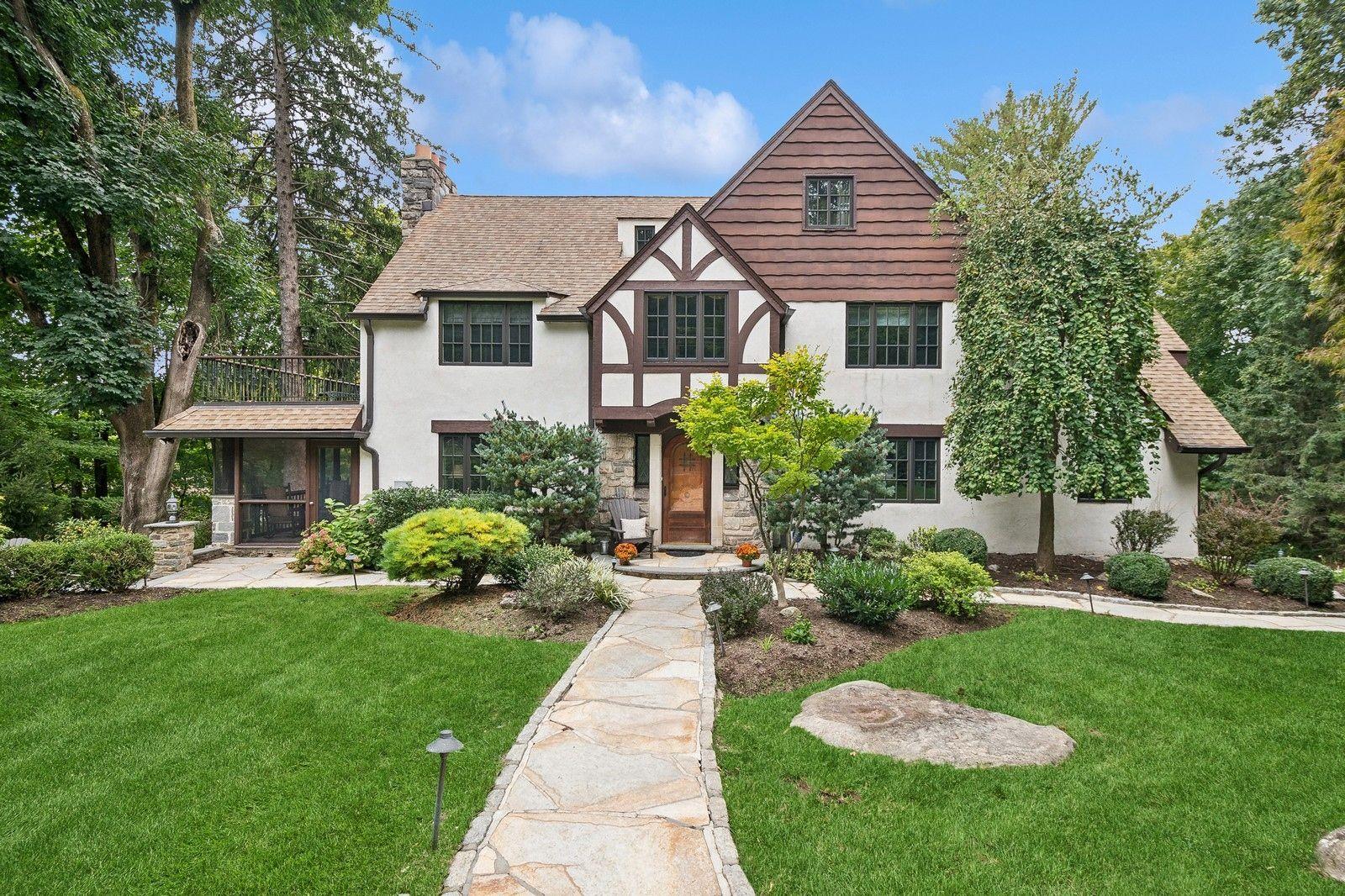 98 Stephenson Terrace Briarcliff Manor, NY 10510 - Photo 1 of 50 Tudor home featuring a front yard, a chimney, and stucco siding