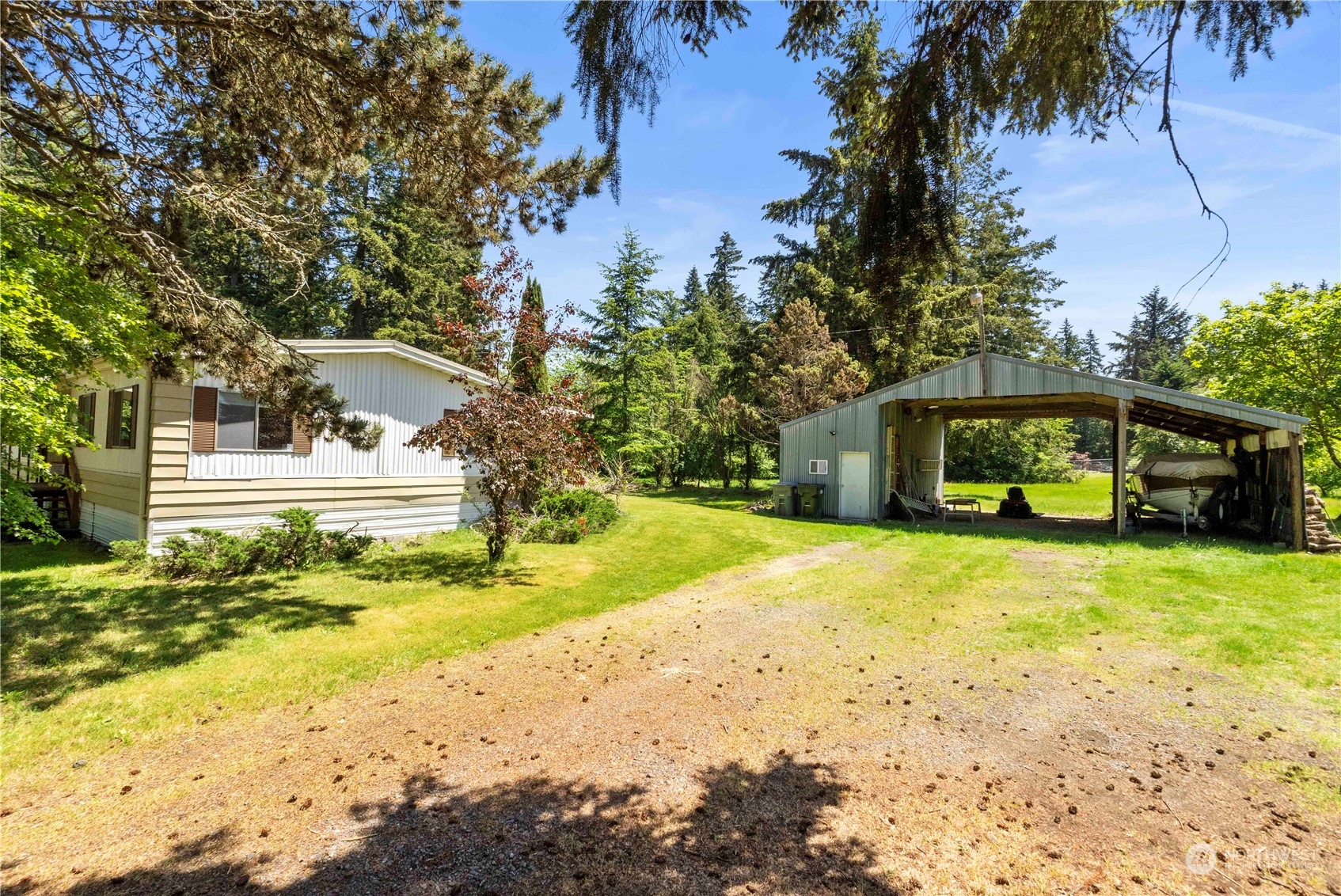 20917 Wright Road East Spanaway, WA 98387 - Photo 3 of 33 a yellow house with trees in front of it