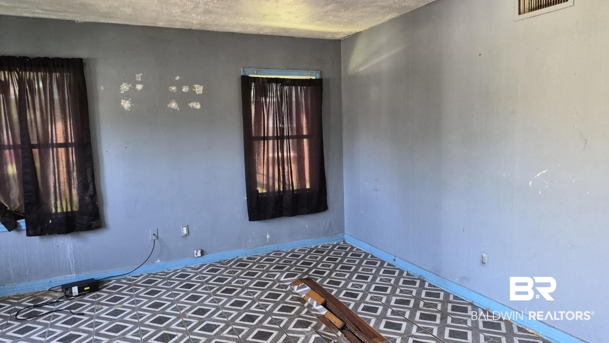 2207 Roberta Drive Mobile, AL 36617 - Photo 5 of 14 Empty room featuring baseboards