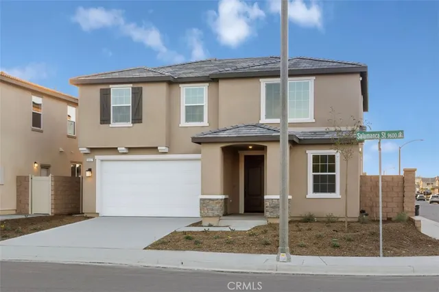 a front view of a house with a garage