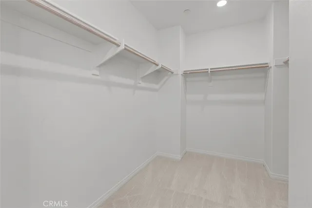 a bathroom with a double vanity sink mirror and shower