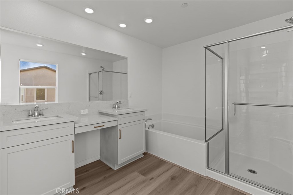 9667 Salamanca Street Riverside, CA 92508 - Photo 12 of 15 a bathroom with a double vanity sink mirror and shower