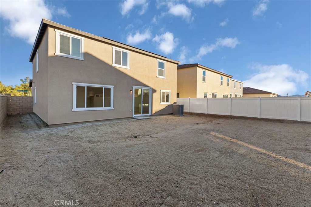 9667 Salamanca Street Riverside, CA 92508 - Photo 13 of 15 a view of a house with backyard and garage
