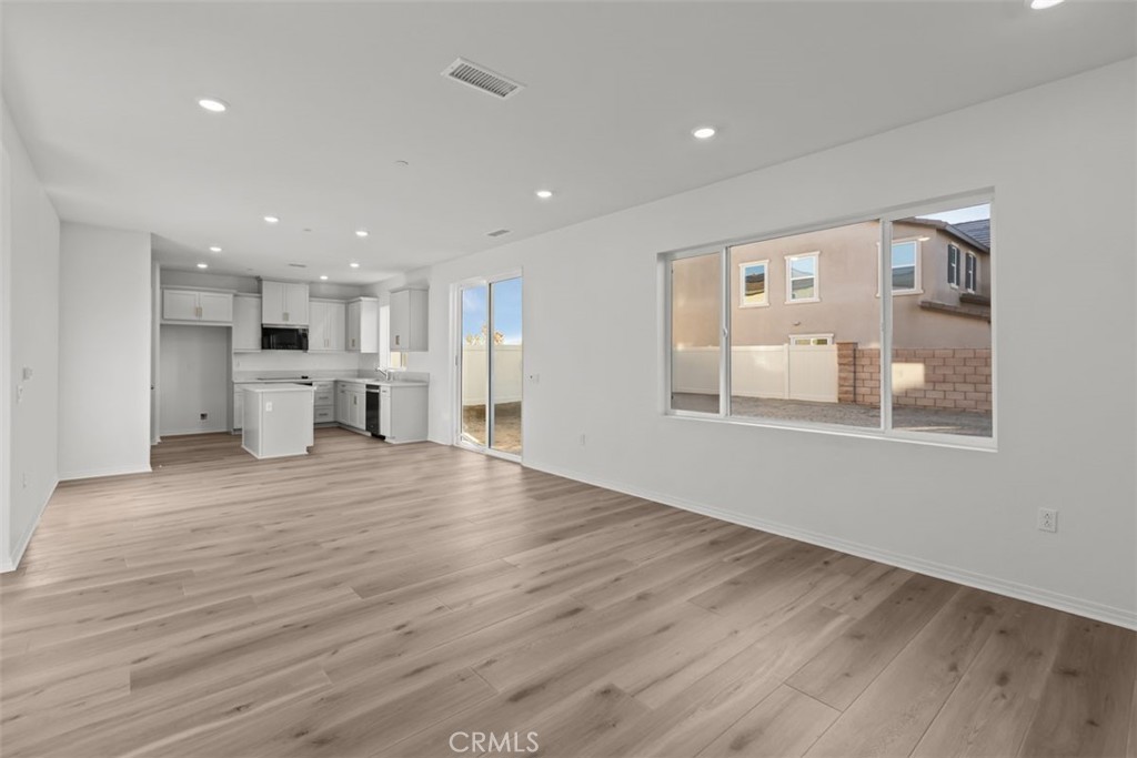 9667 Salamanca Street Riverside, CA 92508 - Photo 3 of 15 a view of a kitchen with a sink and a large window