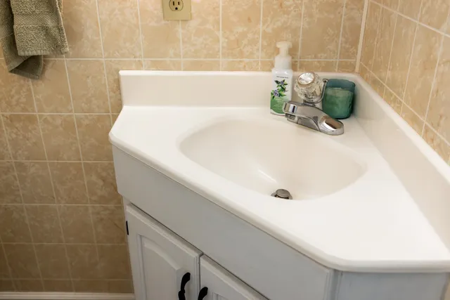 an aerial view of a house with yard swimming pool and ocean view