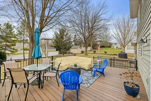 a view of a patio with furniture and wooden floor