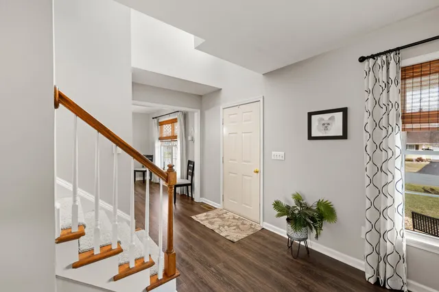 a view of entryway with wooden floor