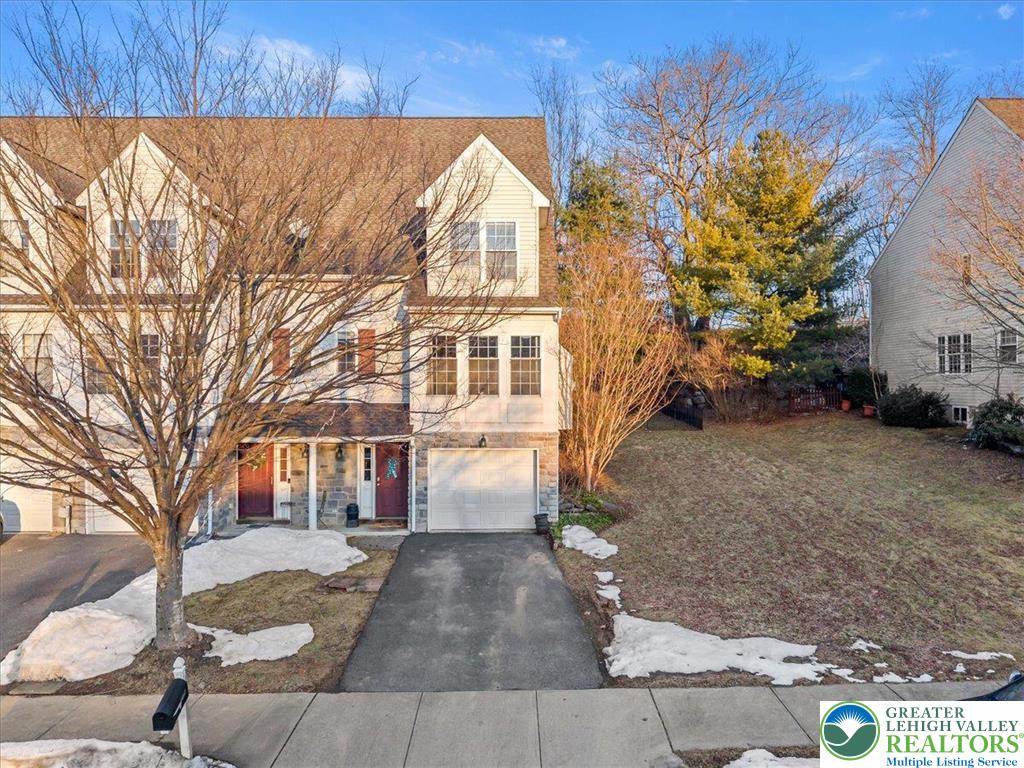 a view of a street with a building in the background