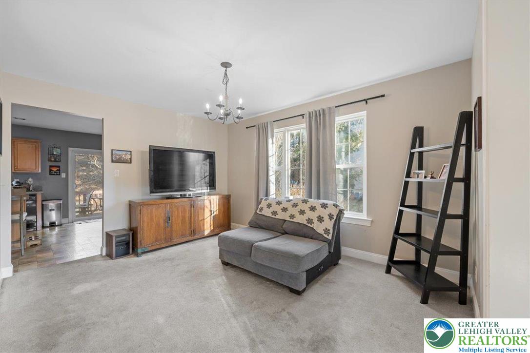 1409 Ravena Street Bethlehem, PA 18015 - Photo 13 of 40 a living room with furniture and a flat screen tv