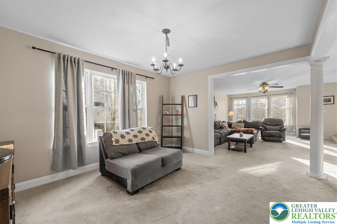 1409 Ravena Street Bethlehem, PA 18015 - Photo 14 of 40 a living room with furniture and a chandelier