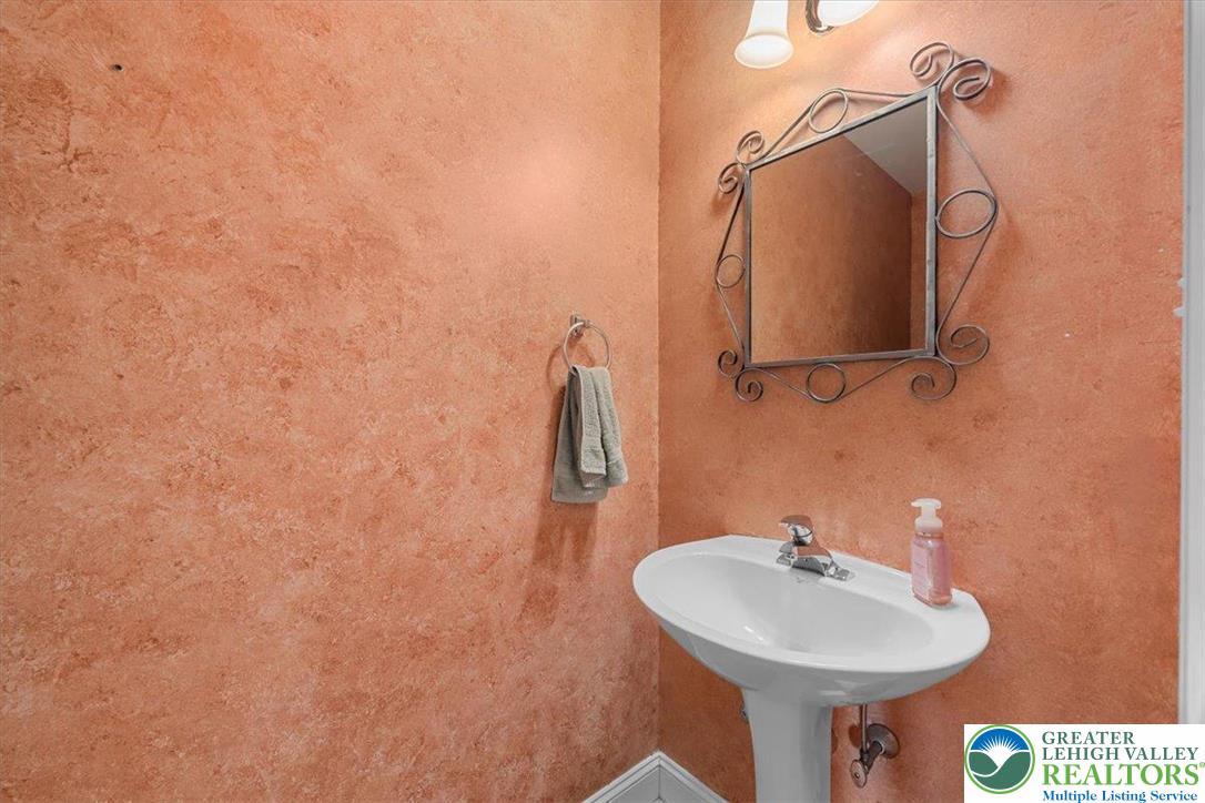 1409 Ravena Street Bethlehem, PA 18015 - Photo 15 of 40 a bathroom with a sink and mirror