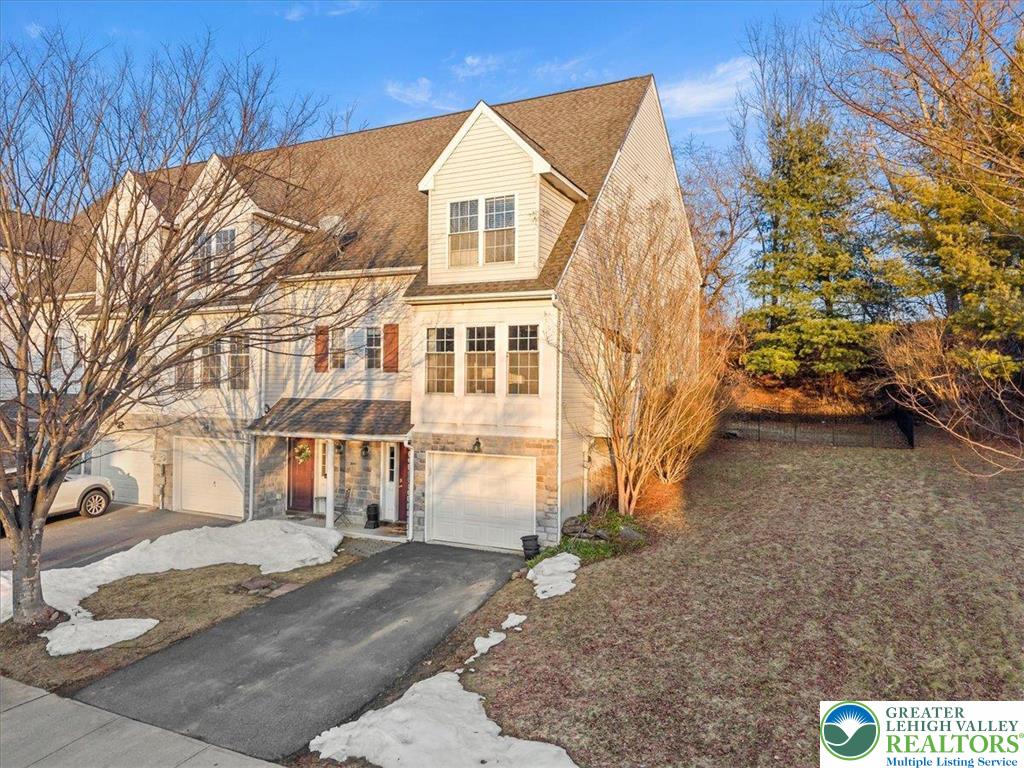 1409 Ravena Street Bethlehem, PA 18015 - Photo 2 of 40 a view of a white house with a large tree