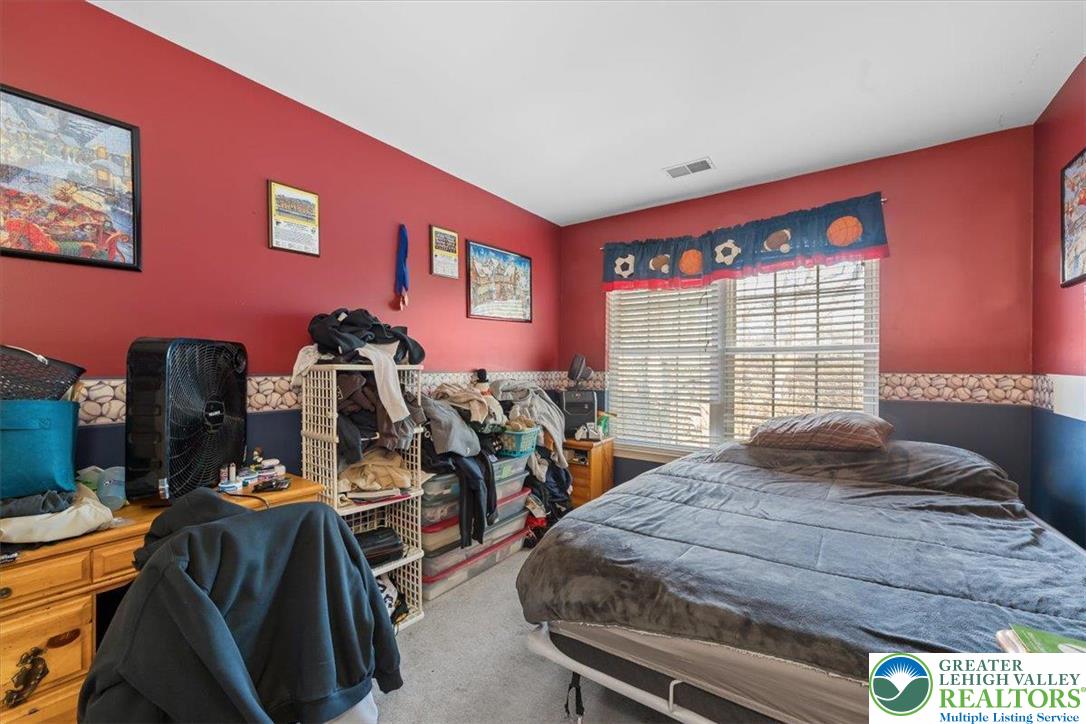 1409 Ravena Street Bethlehem, PA 18015 - Photo 26 of 40 a bedroom with furniture and a window