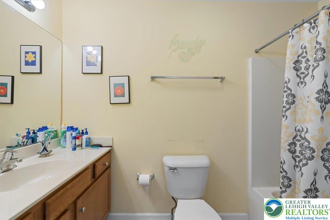 1409 Ravena Street Bethlehem, PA 18015 - Photo 28 of 40 a bathroom with a sink toilet and vanity