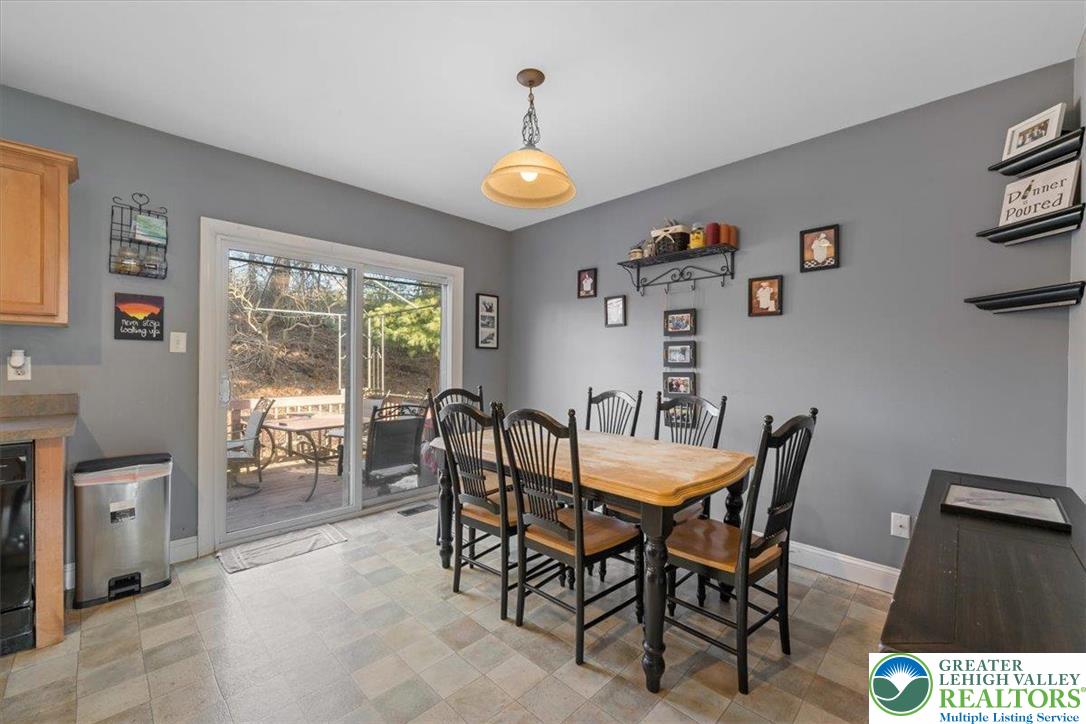 1409 Ravena Street Bethlehem, PA 18015 - Photo 9 of 40 a view of a dining room with furniture large window and wooden floor