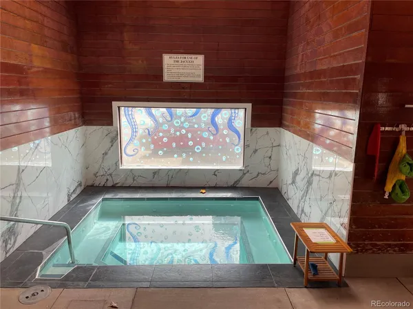 a swimming pool with outdoor seating