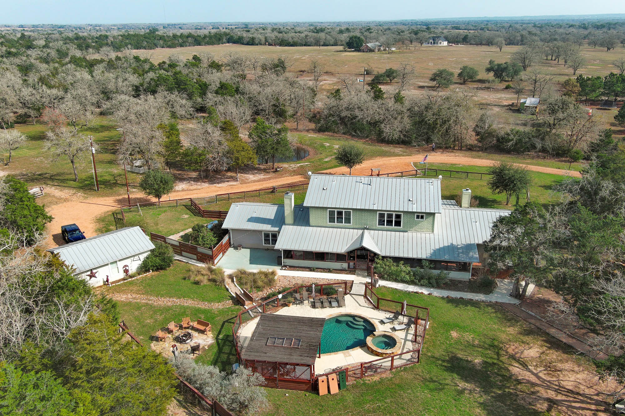 418 Vyvjala Road Smithville, TX 78957 - Photo 9 of 40 Aerial view of sparsely populated area featuring a pool