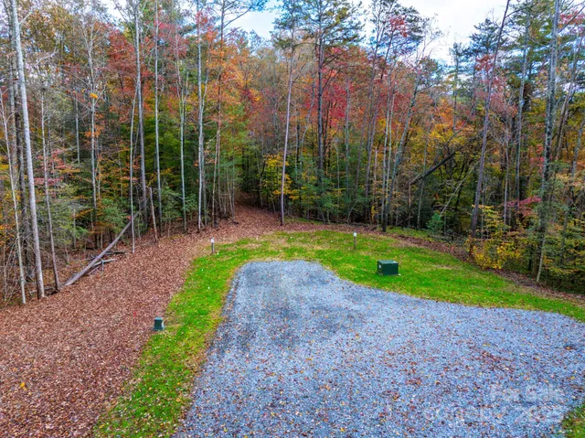 a view of a pathway with a wrought fence