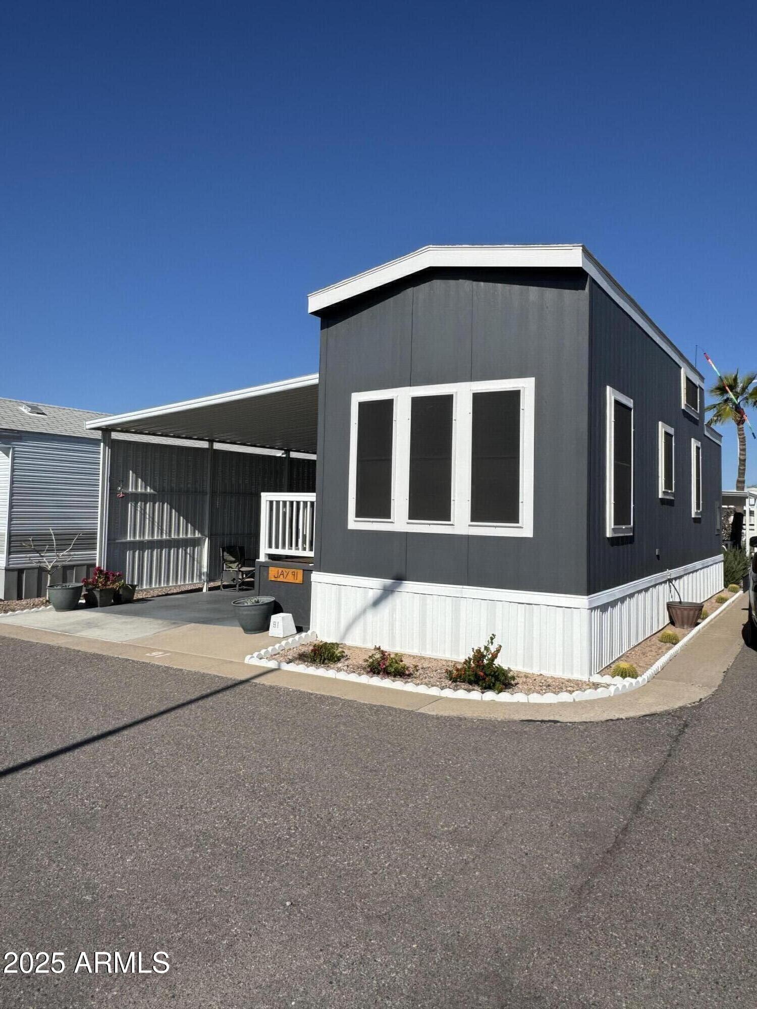 146 North Merrill Road, Unit 91 Apache Junction, AZ 85120 - Photo 1 of 3 a front view of a house