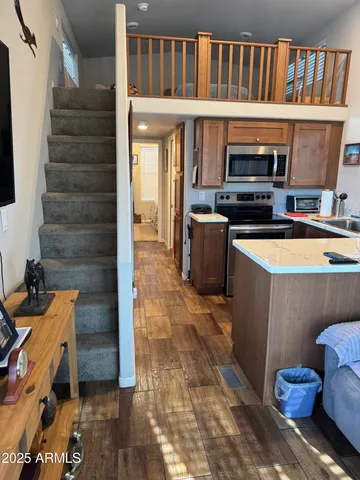 a kitchen with stove and cabinets
