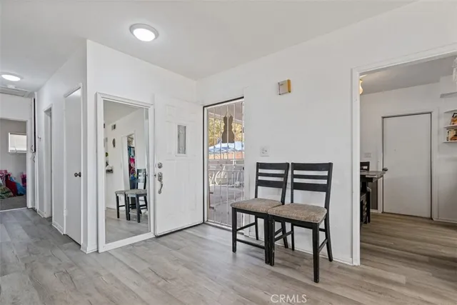 a view of a livingroom with furniture and wooden floor