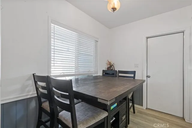 a view of a dining table and chairs in a room