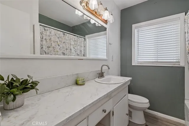 a front view of a house with yard and seating area