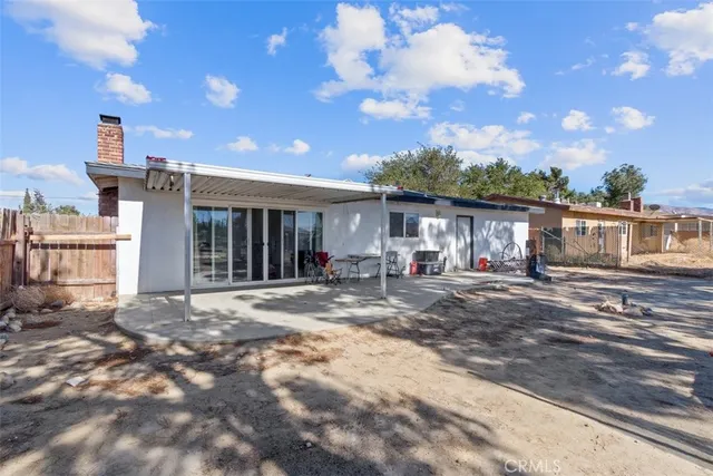 a view of a street with a tree