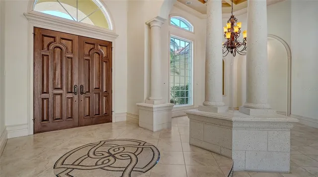 a view of a livingroom with wooden floor and a fireplace
