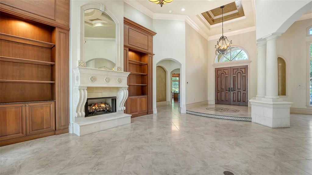 3218 Signet Court Sarasota, FL 34240 - Photo 14 of 82 a view of a livingroom with wooden floor and a fireplace