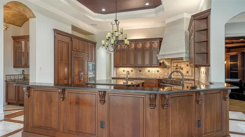 a living room with furniture and a glass door