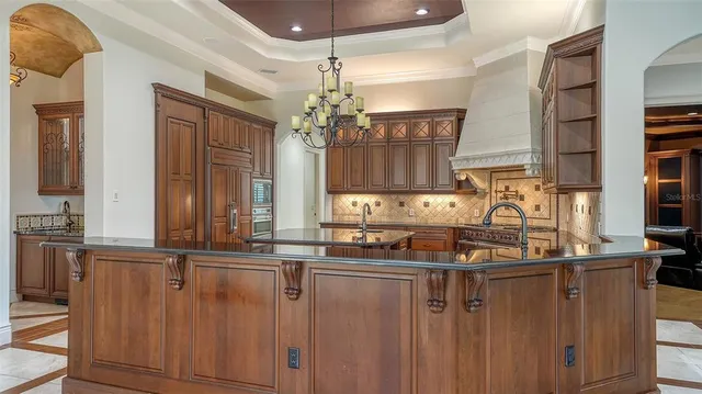 a living room with furniture and a glass door