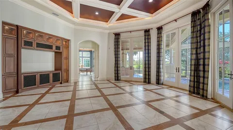 a bathroom with a granite countertop sink a mirror and shower