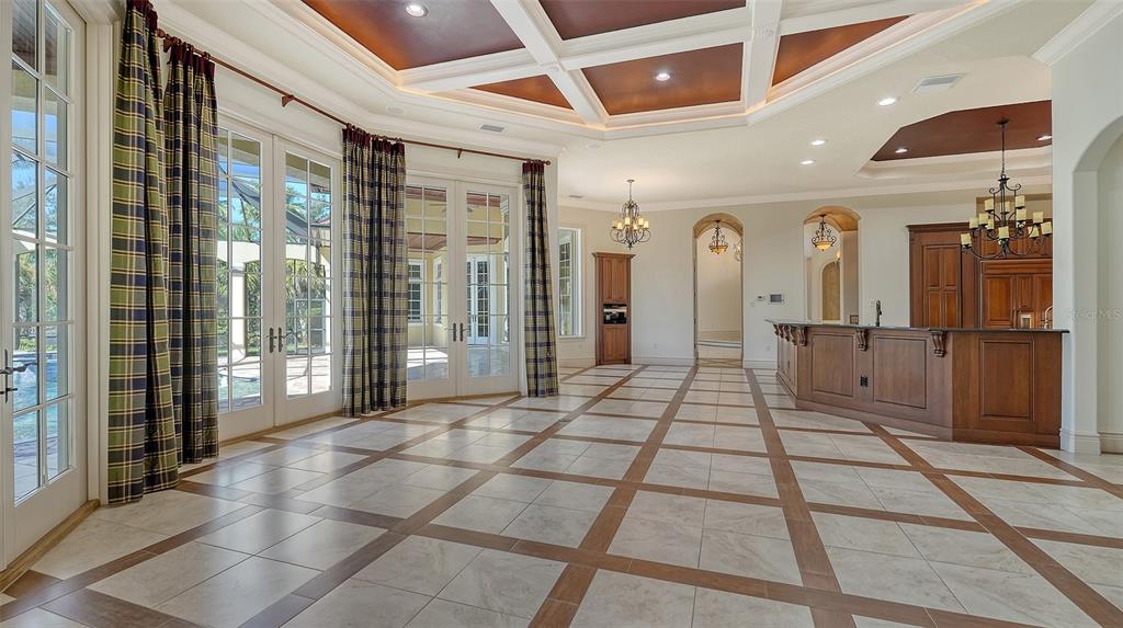 3218 Signet Court Sarasota, FL 34240 - Photo 25 of 82 a bathroom with a glass shower door and a glass door