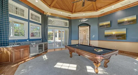 a view of walk in closet and bedroom