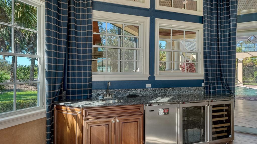 3218 Signet Court Sarasota, FL 34240 - Photo 28 of 82 a kitchen with granite countertop a stove and a sink