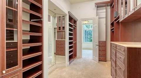 an aerial view of residential houses with outdoor space and street view