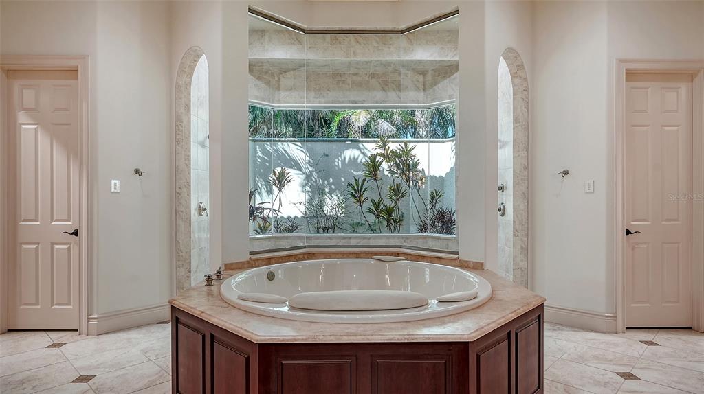 3218 Signet Court Sarasota, FL 34240 - Photo 39 of 82 a bathroom with a granite countertop sink and a mirror