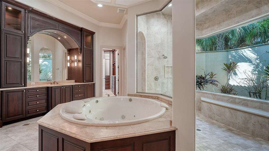 3218 Signet Court Sarasota, FL 34240 - Photo 41 of 82 a bathroom with a sink and a mirror