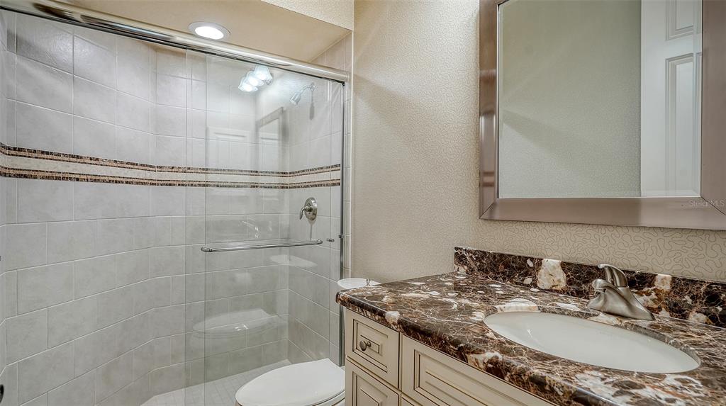 3218 Signet Court Sarasota, FL 34240 - Photo 45 of 82 a bathroom with a sink toilet and shower